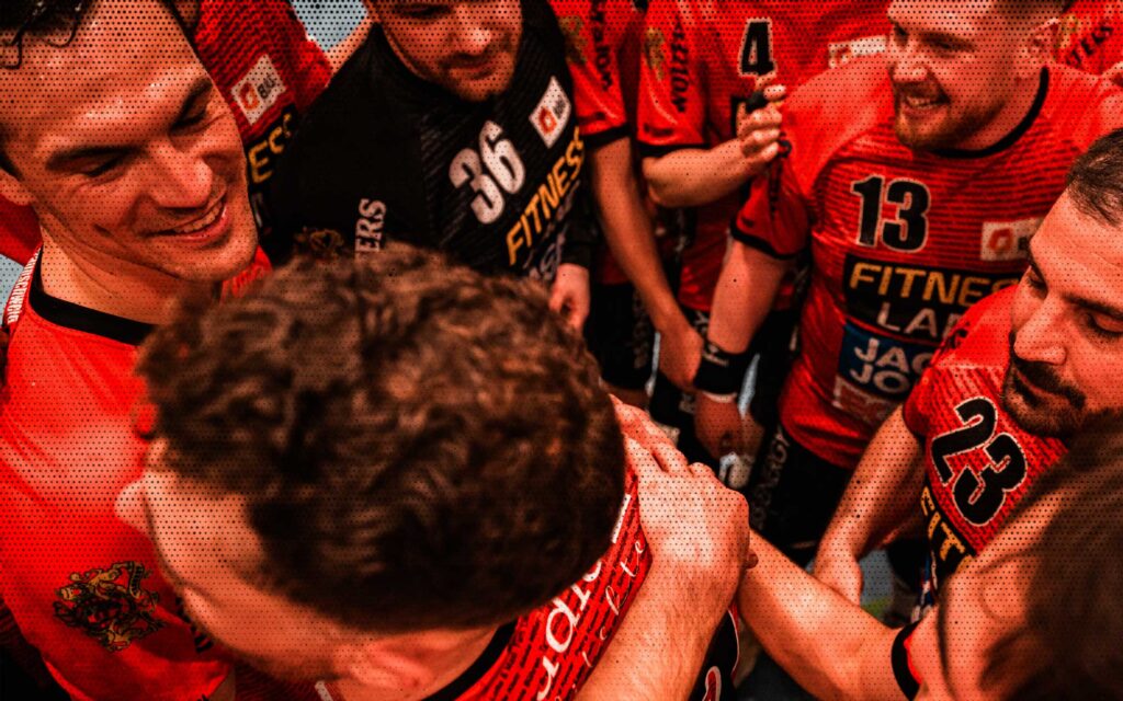 a group of men in sports uniforms